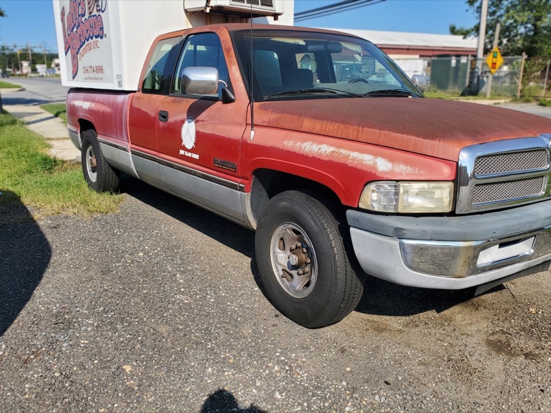 Rusty red Dodge Ram before full restoration
