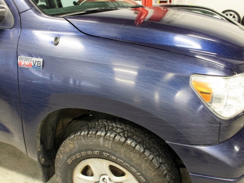 Scuffed Toyota Tundra fender before repair