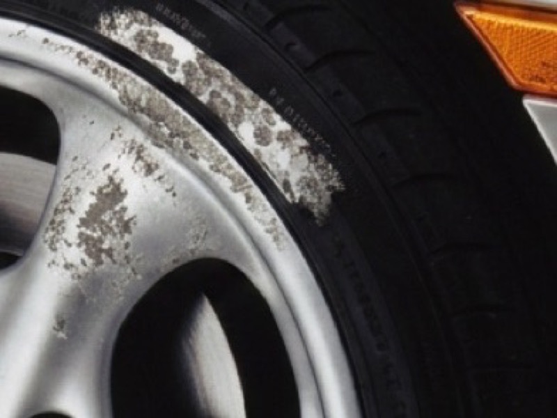 Damaged alloy wheel before strip and refinish