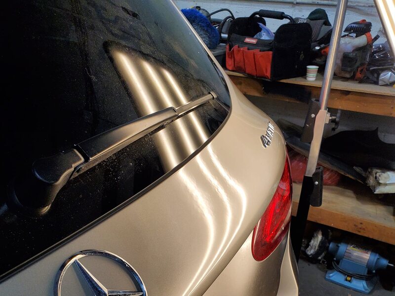 Same trunk lid smooth after paintless dent repair